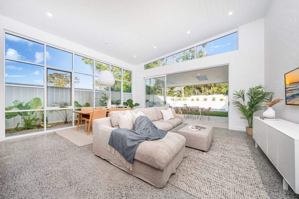 Open-plan living with LED downlights and pendant